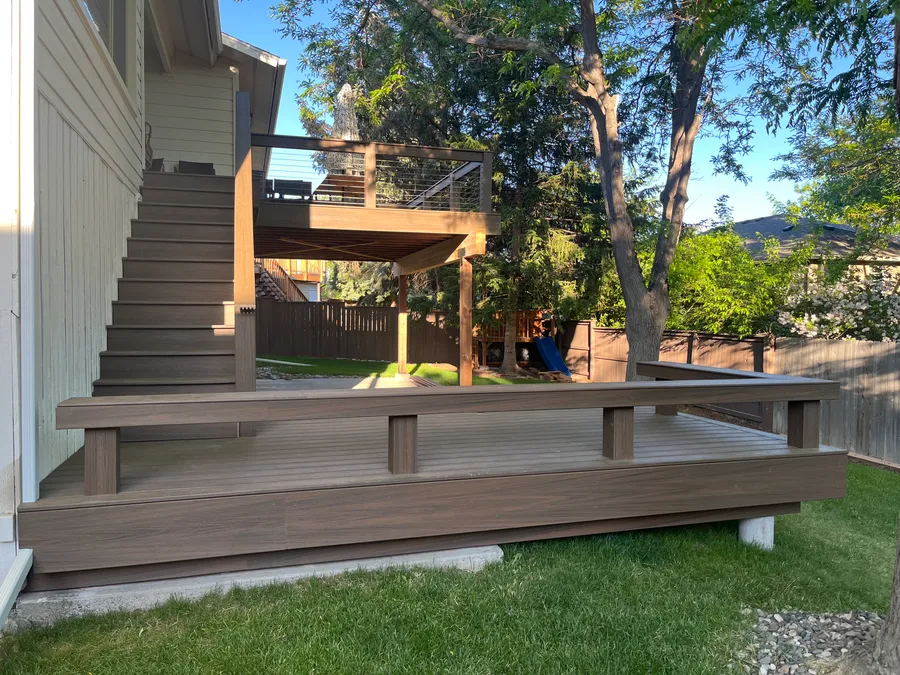 Low composite deck and stairs off the back of a home in Billings, Montana