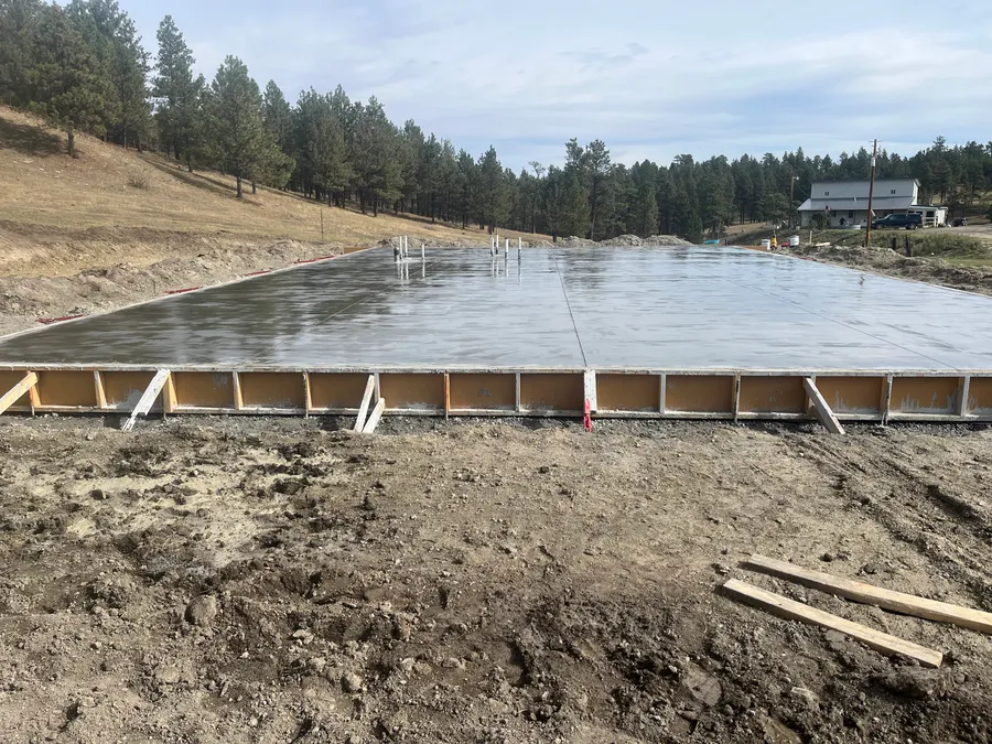 Large finished concrete pad ready for a new stick-framed building