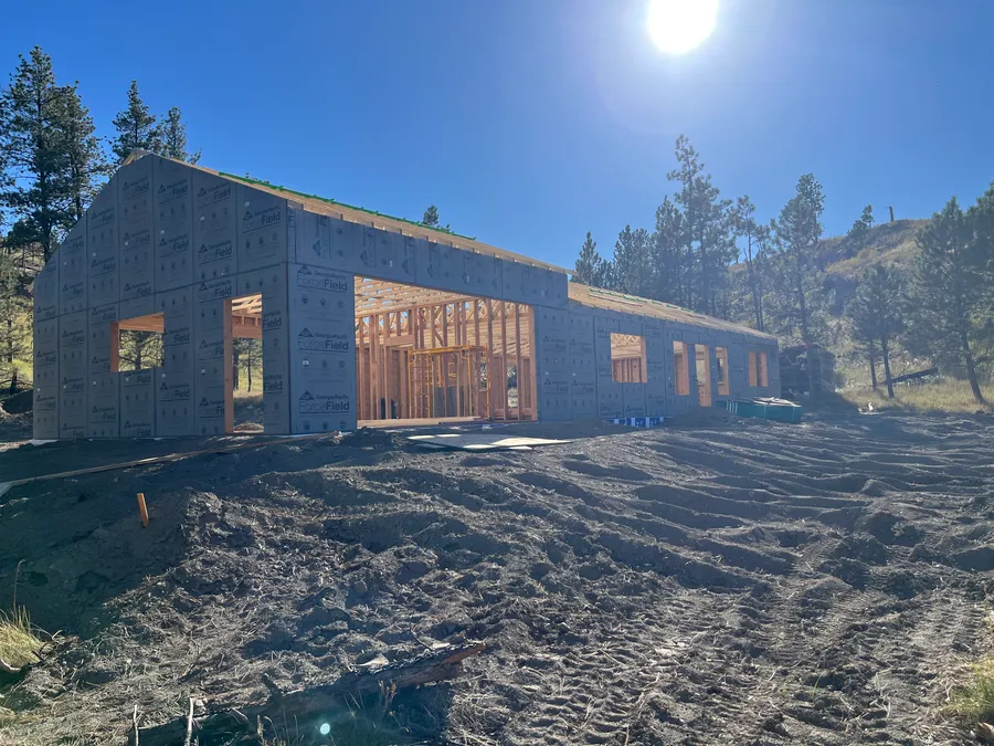 Sheathed shell with window openings before siding
